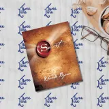 The Secret book cover with a red seal and gold accents