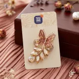 Butterfly saree brooch with intricate design on a saree fabric