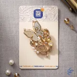 Butterfly saree brooch with intricate design on a saree fabric
