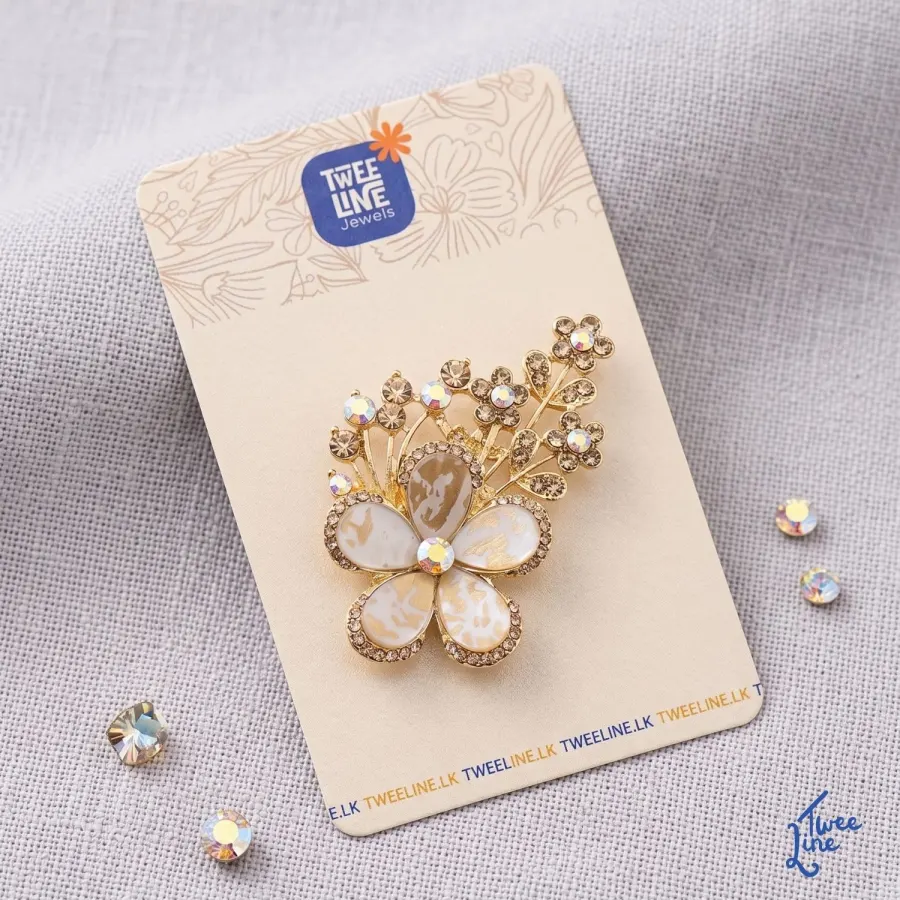 Elegant white flower saree brooch on a saree